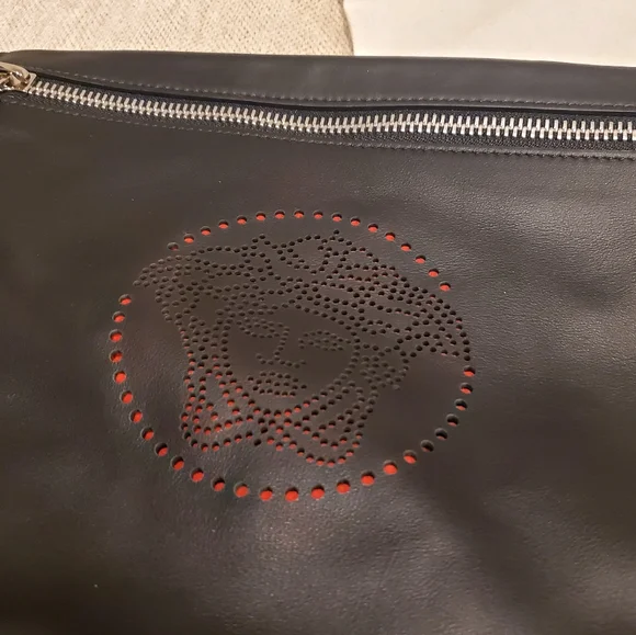 Brand new Versace leather clutch wrislet